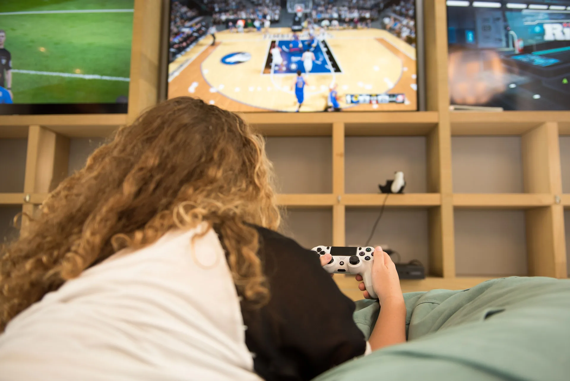 A child plays video games in the game room at The Ritz-Carlton, Grand Cayman.
