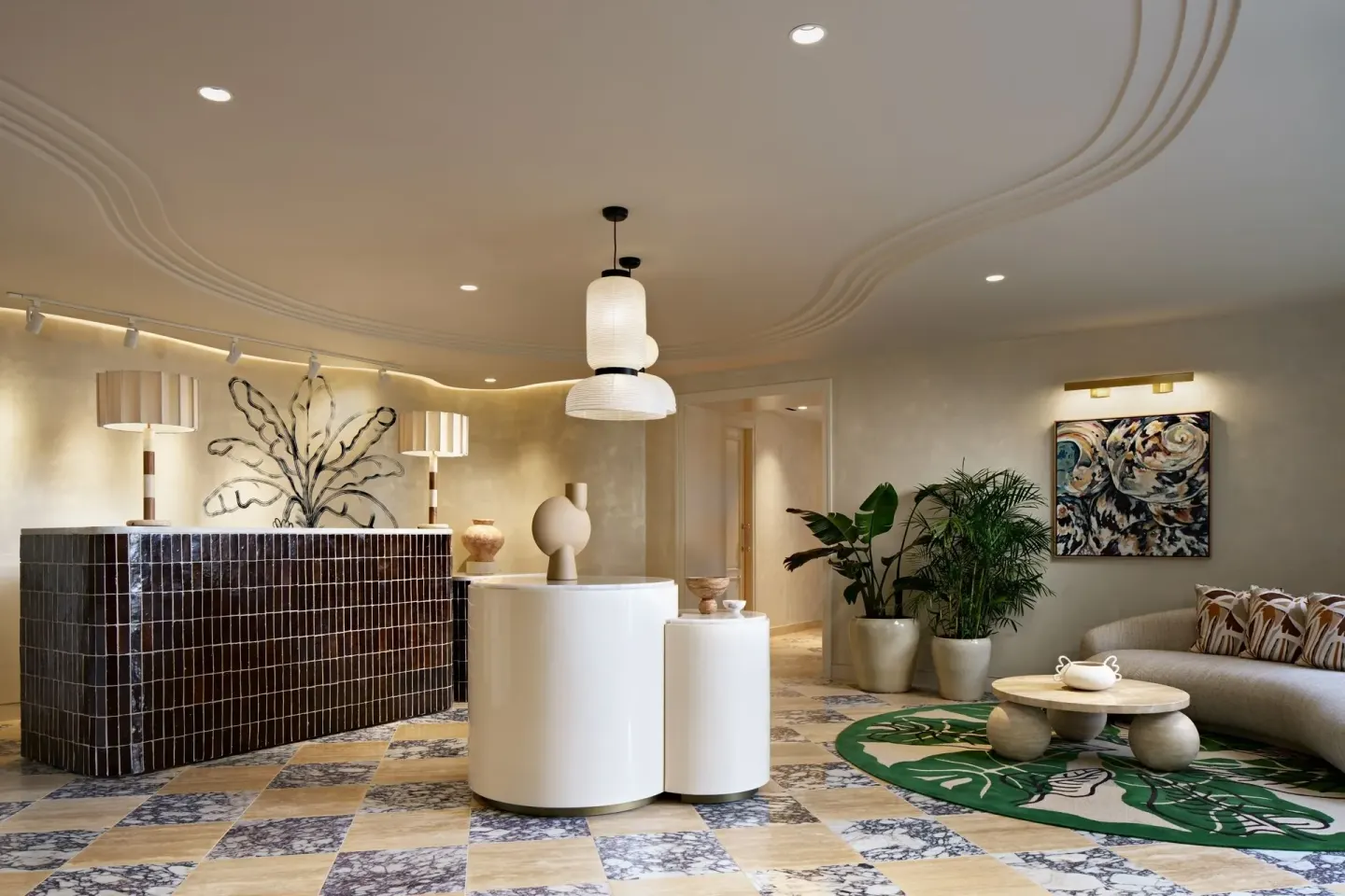 Bright lobby seating area with reception desk at The Ritz-Carlton, Grand Cayman.