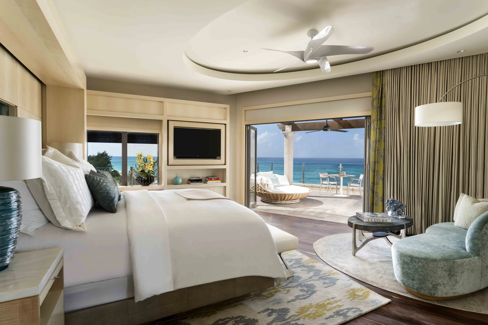 Grand Suite bedroom with king bed and oceanfront terrace at The Ritz-Carlton, Grand Cayman.