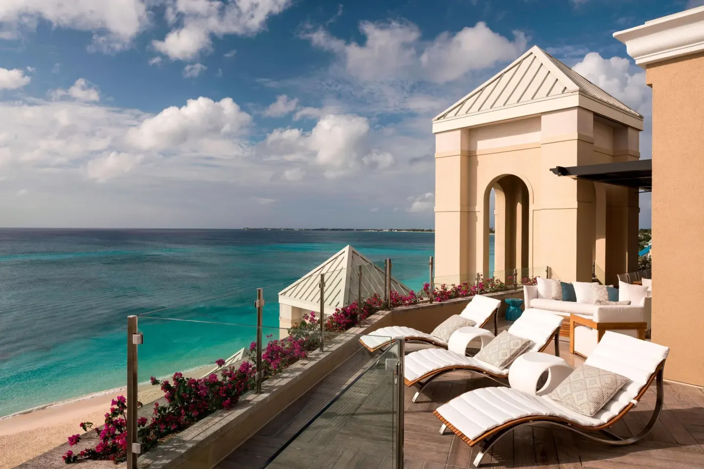 Grand Suite oceanfront terrace with loungers at The Ritz-Carlton, Grand Cayman.