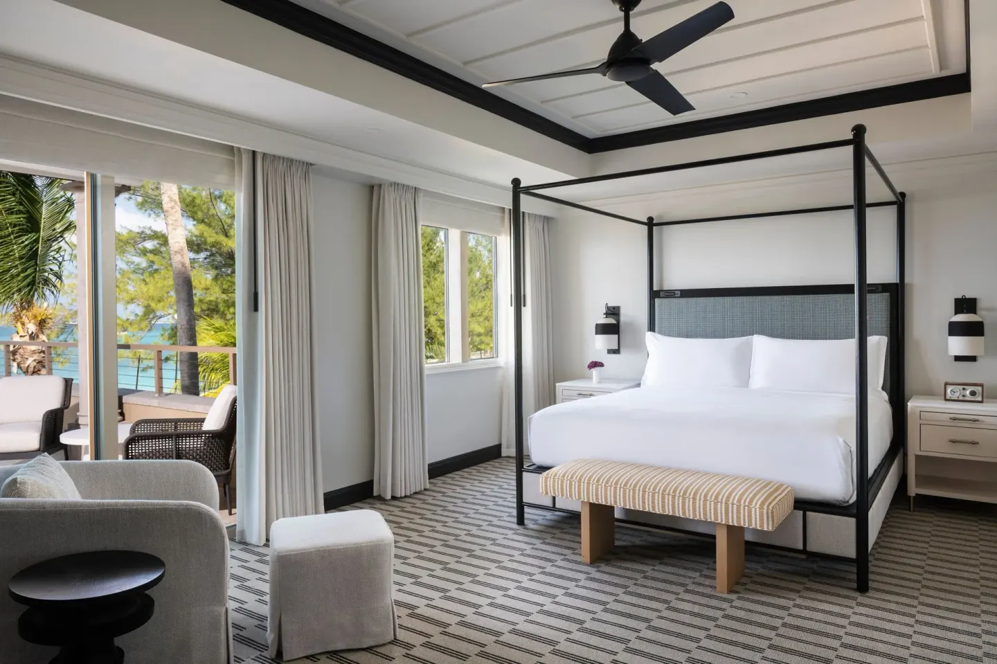 Presidential Suite oceanfront bedroom with four-poster king bed at The Ritz-Carlton, Grand Cayman.