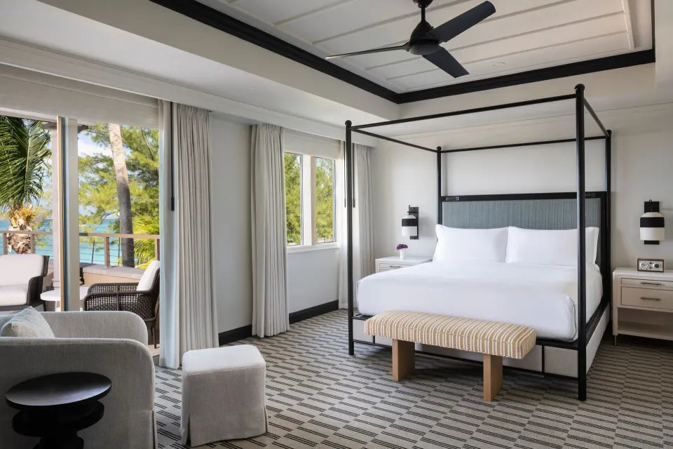 Presidential Suite oceanfront bedroom with four-poster king bed at The Ritz-Carlton, Grand Cayman.