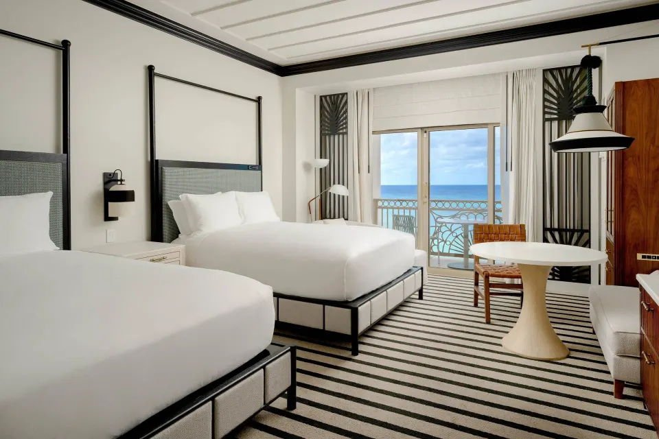 Oceanfront balcony room with two beds at The Ritz-Carlton, Grand Cayman.