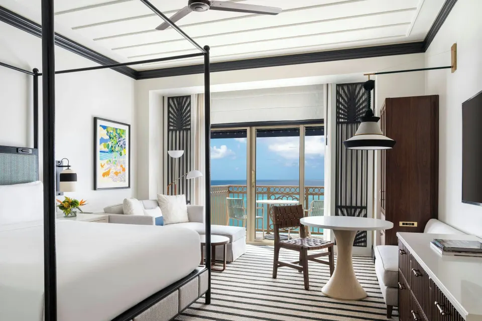 Oceanfront king room with balcony doors and sea view at The Ritz-Carlton, Grand Cayman.