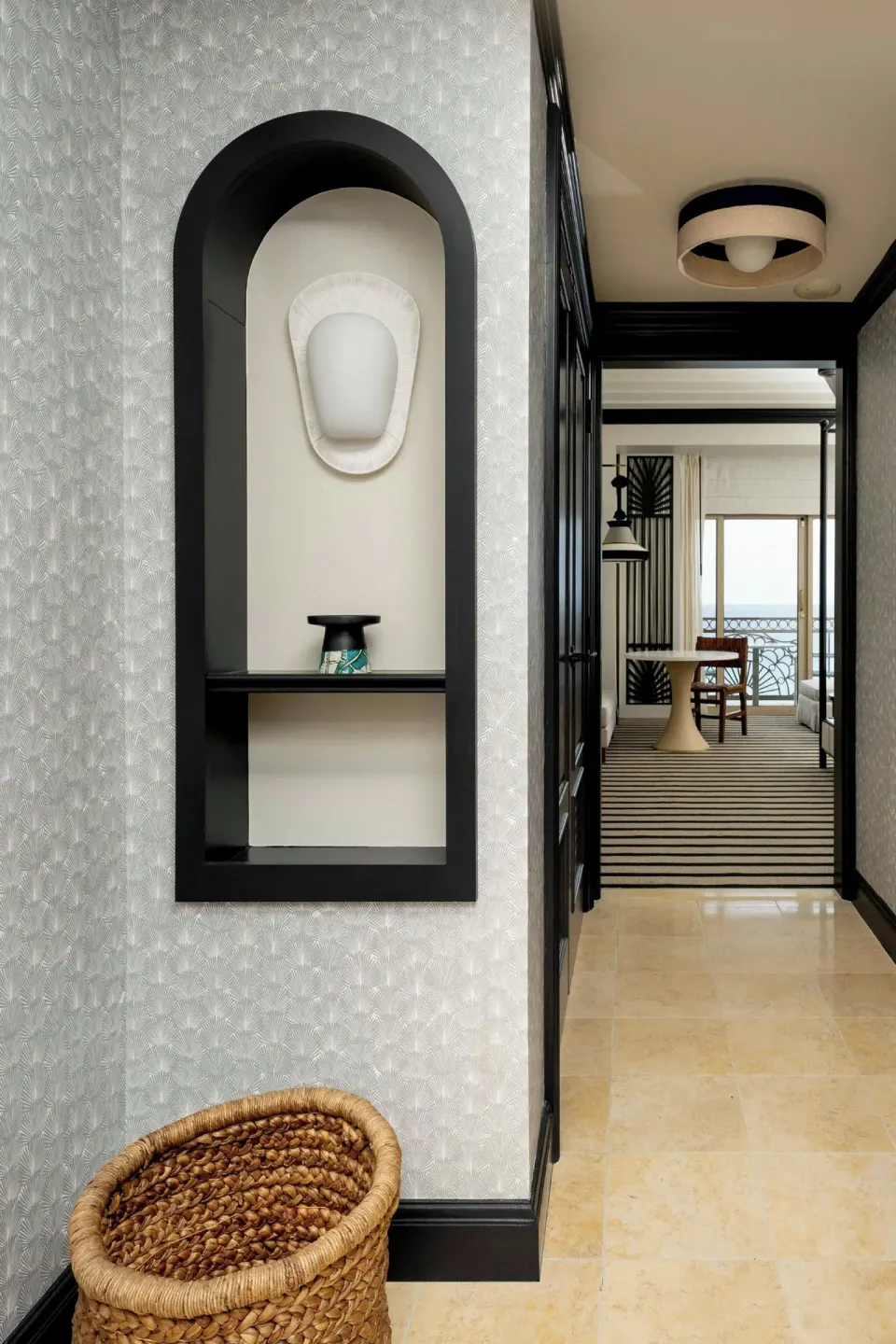 Entry hall to a Resort View room with balcony beyond at The Ritz-Carlton, Grand Cayman.
