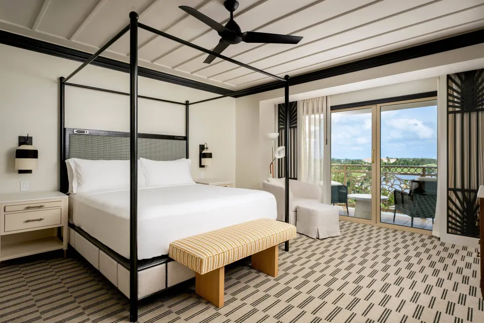 Resort View room with four-poster king bed and balcony at The Ritz-Carlton, Grand Cayman.