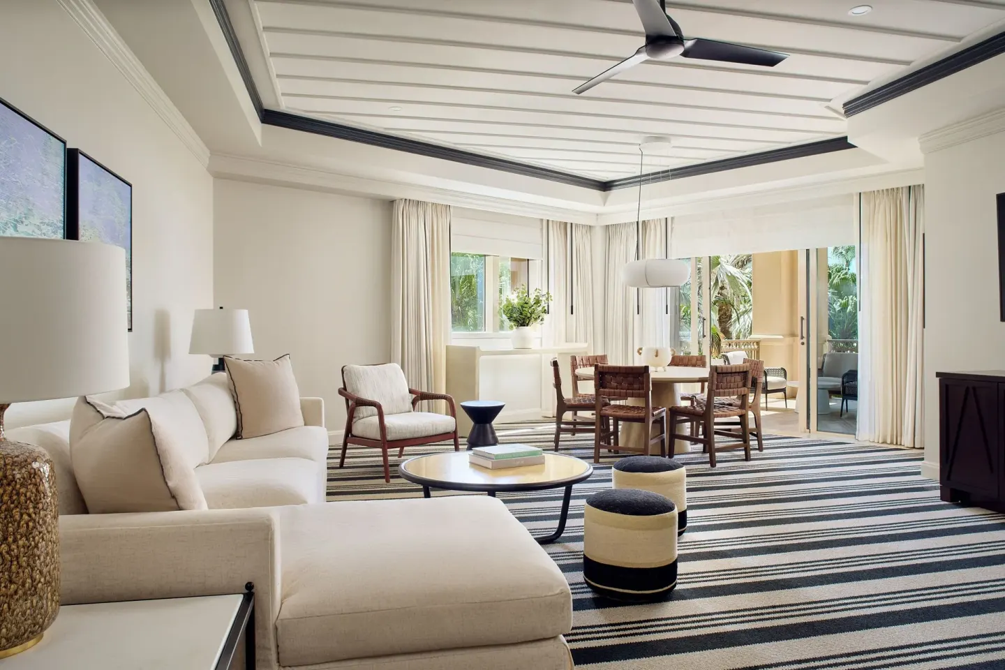 Living and dining area of a two-bedroom resort-view suite at The Ritz-Carlton, Grand Cayman.