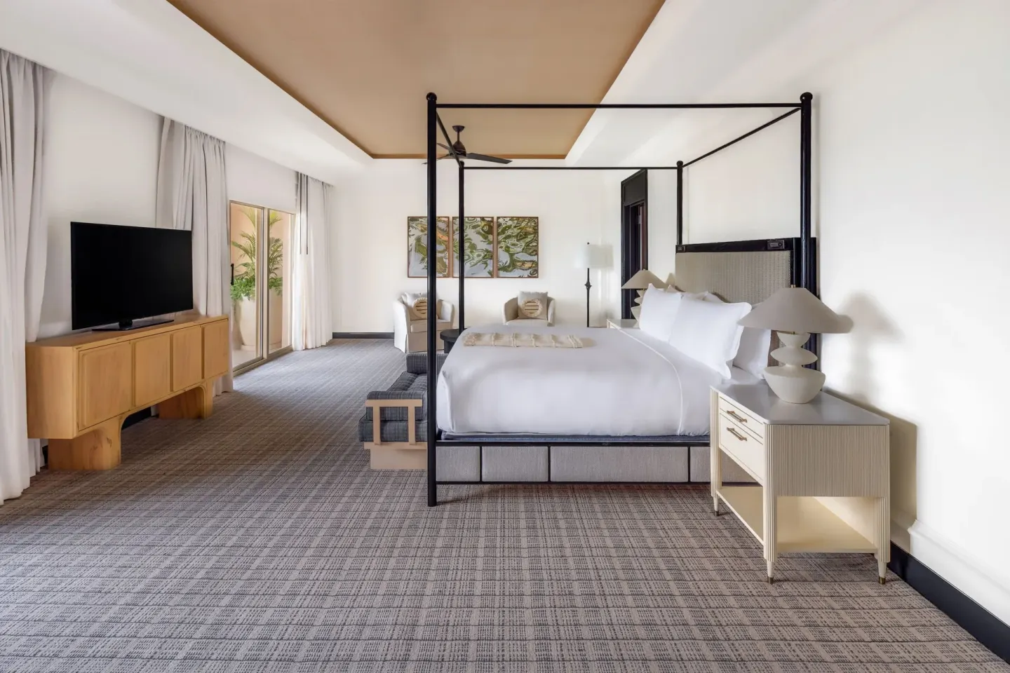 Oceanfront two-bedroom terrace suite bedroom with canopy king bed at The Ritz-Carlton, Grand Cayman.