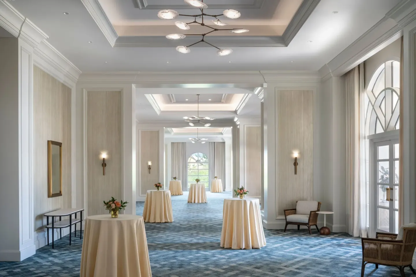 Reception foyer with cocktail tables at The Ritz-Carlton, Grand Cayman.