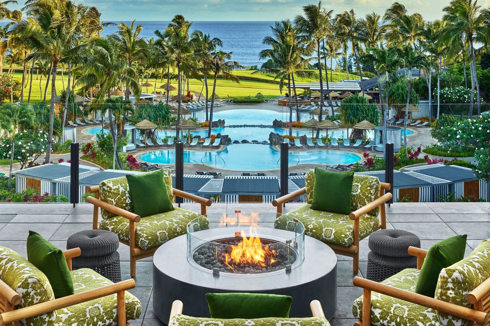Fire pit seating overlooks the pools and ocean at The Ritz-Carlton Maui, Kapalua.