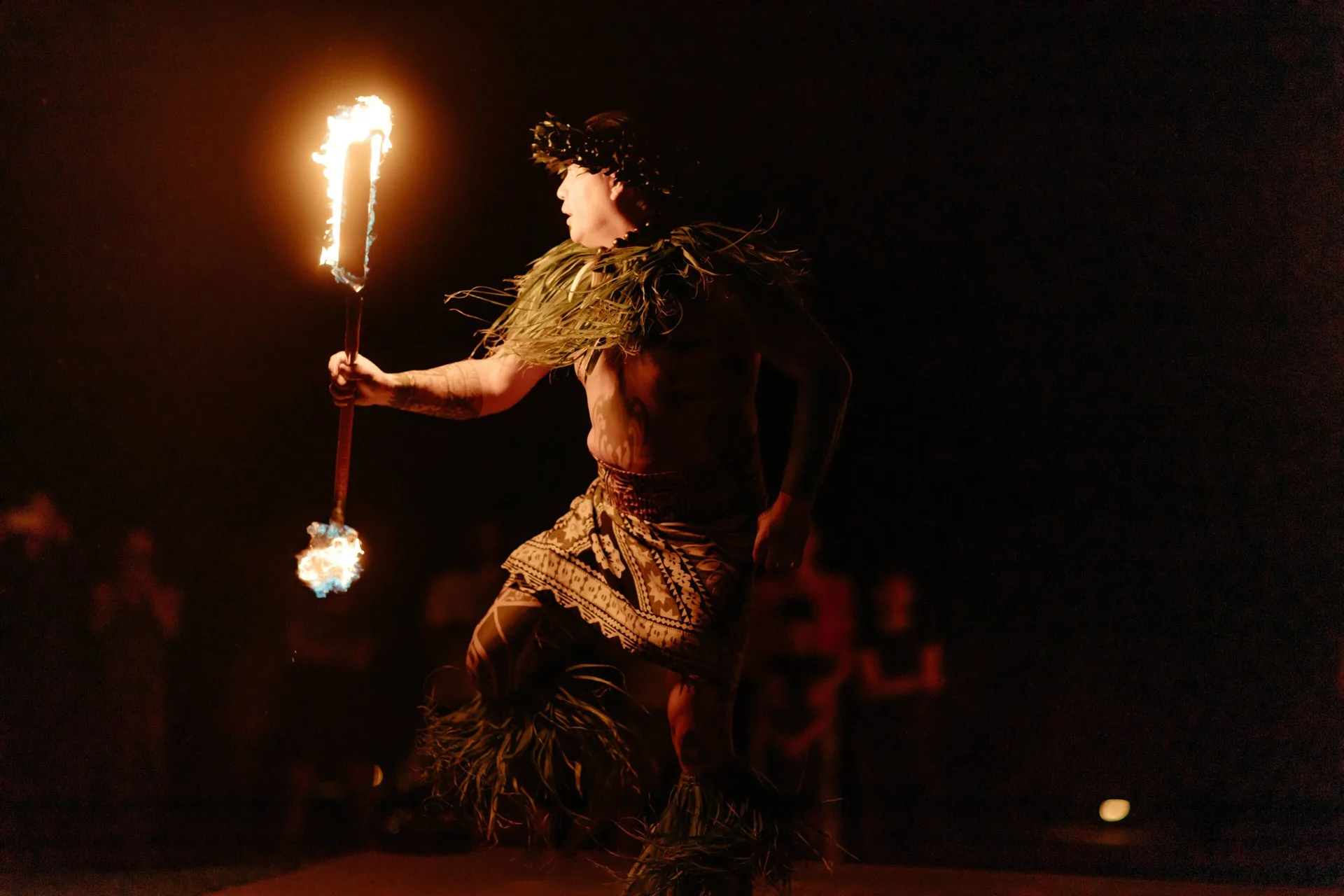 A fire dancer performs at night at The Ritz-Carlton Maui, Kapalua.