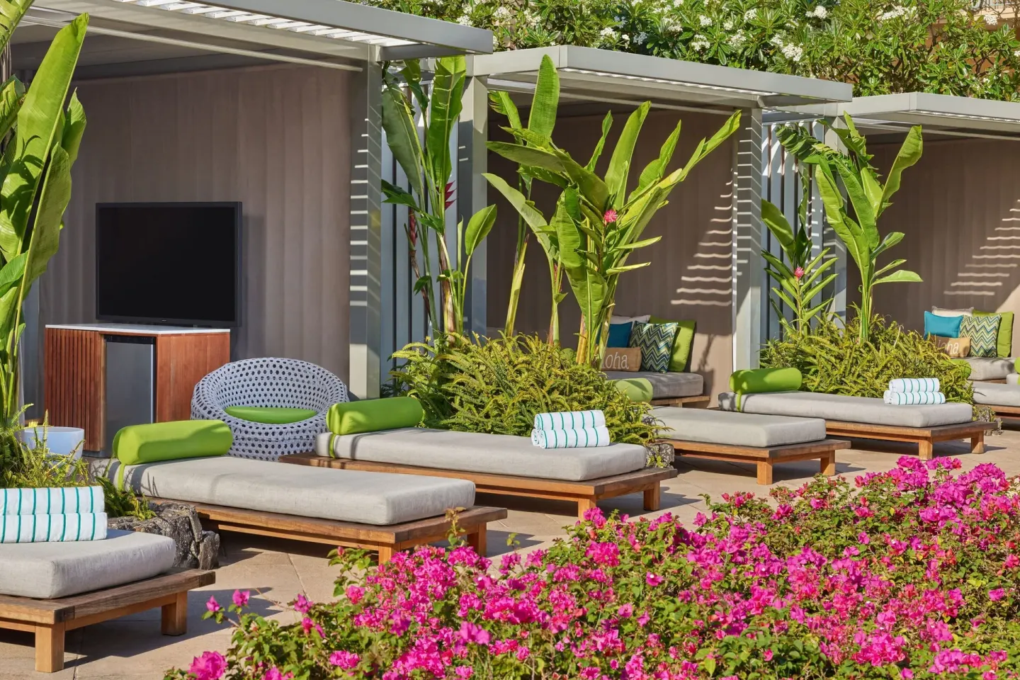 Poolside cabanas and daybeds at The Ritz-Carlton Maui, Kapalua.