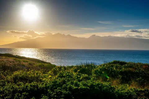 Ocean and island scenery at sunset near The Ritz-Carlton Maui, Kapalua.