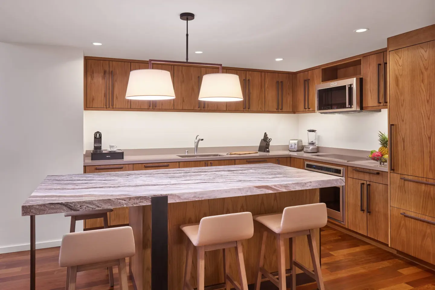 Residential suite kitchen with island seating at The Ritz-Carlton Maui, Kapalua.