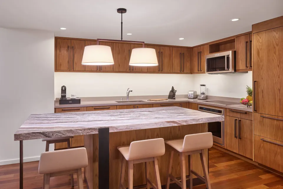 Residential suite kitchen with island seating at The Ritz-Carlton Maui, Kapalua.