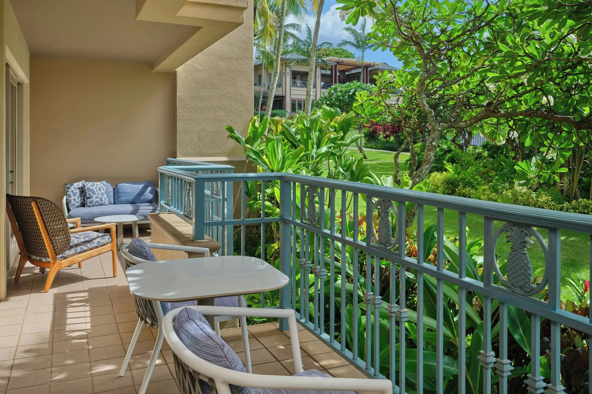 Garden-view balcony seating at The Ritz-Carlton Maui, Kapalua.