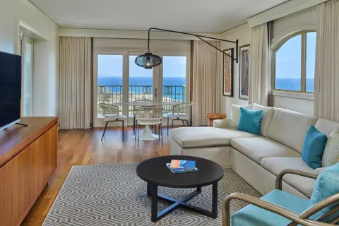 Oceanfront suite living room with sofa at The Ritz-Carlton Maui, Kapalua.