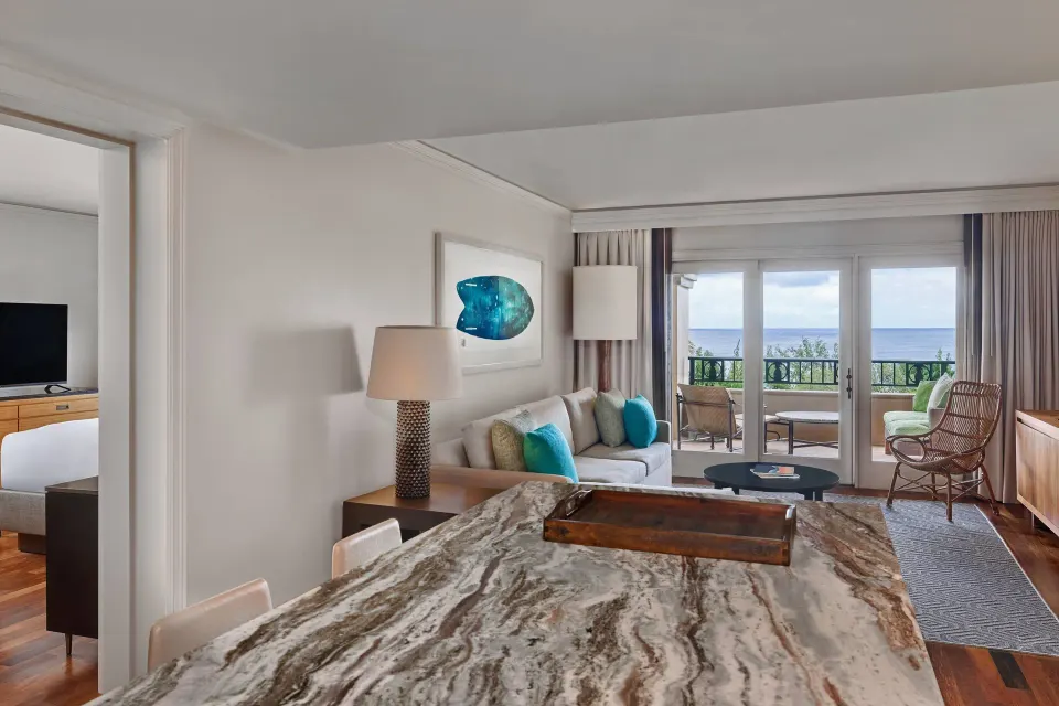 Club Room living area and balcony ocean view at The Ritz-Carlton Maui, Kapalua.