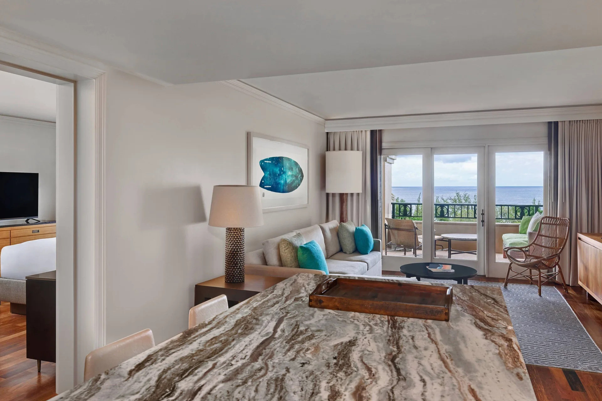 Club Room living area and balcony ocean view at The Ritz-Carlton Maui, Kapalua.