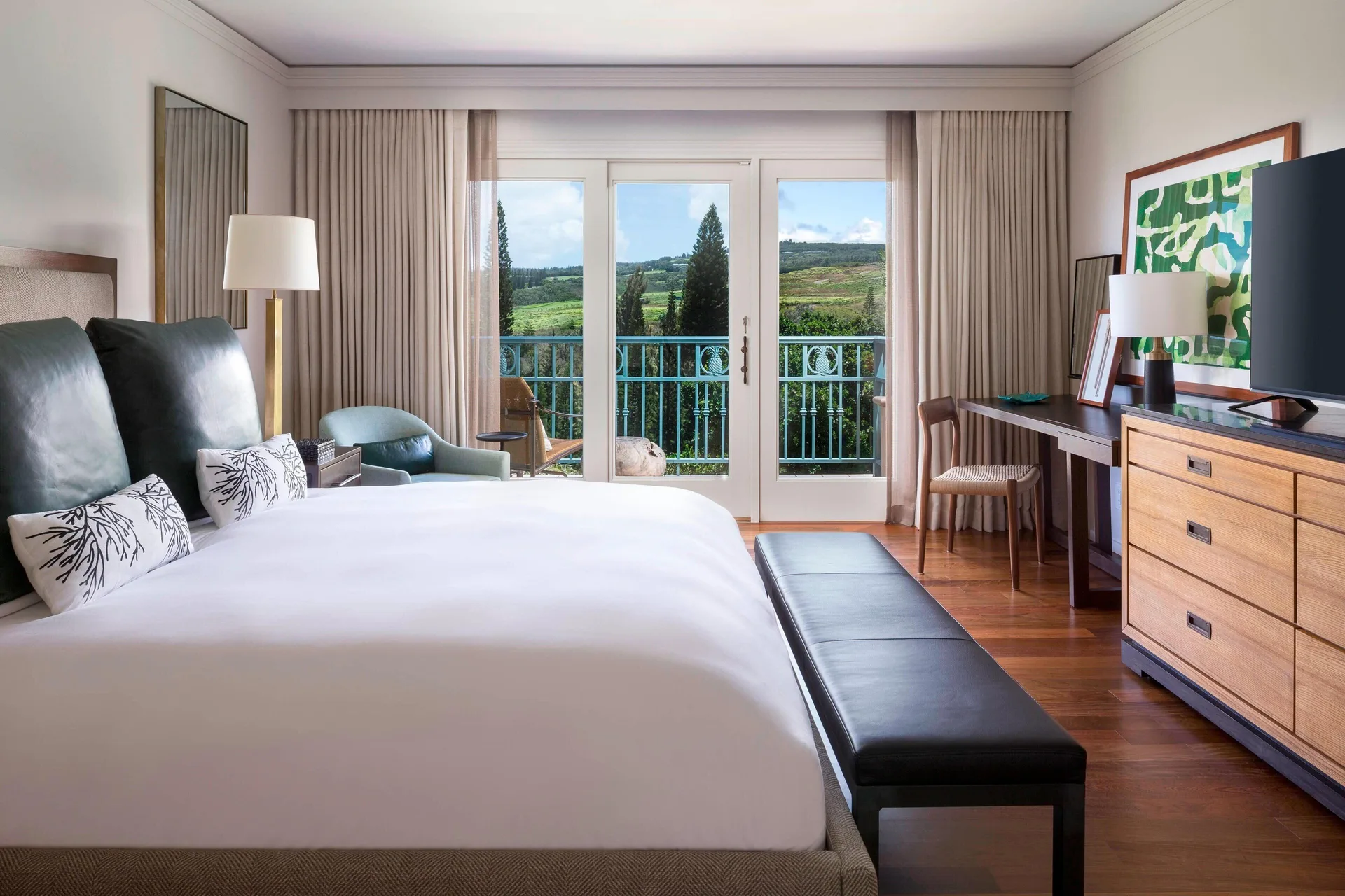 Deluxe Resort View king room with balcony doors at The Ritz-Carlton Maui, Kapalua.