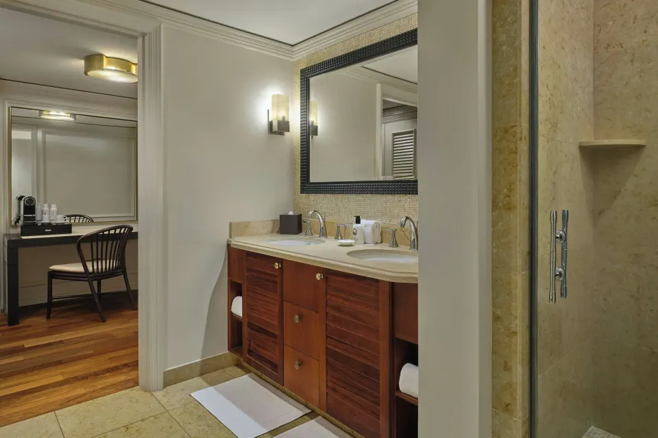 Bathroom vanity and shower in a 1 Bedroom Suite at The Ritz-Carlton Maui, Kapalua.