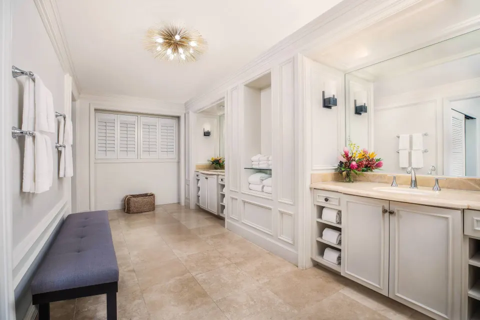 Presidential Suite bathroom with long vanity and bench at The Ritz-Carlton Maui, Kapalua.