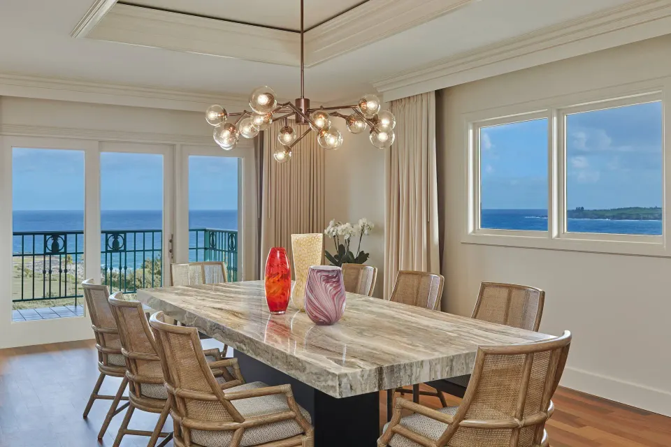 Presidential Suite dining room at The Ritz-Carlton Maui, Kapalua with marble table and ocean views.