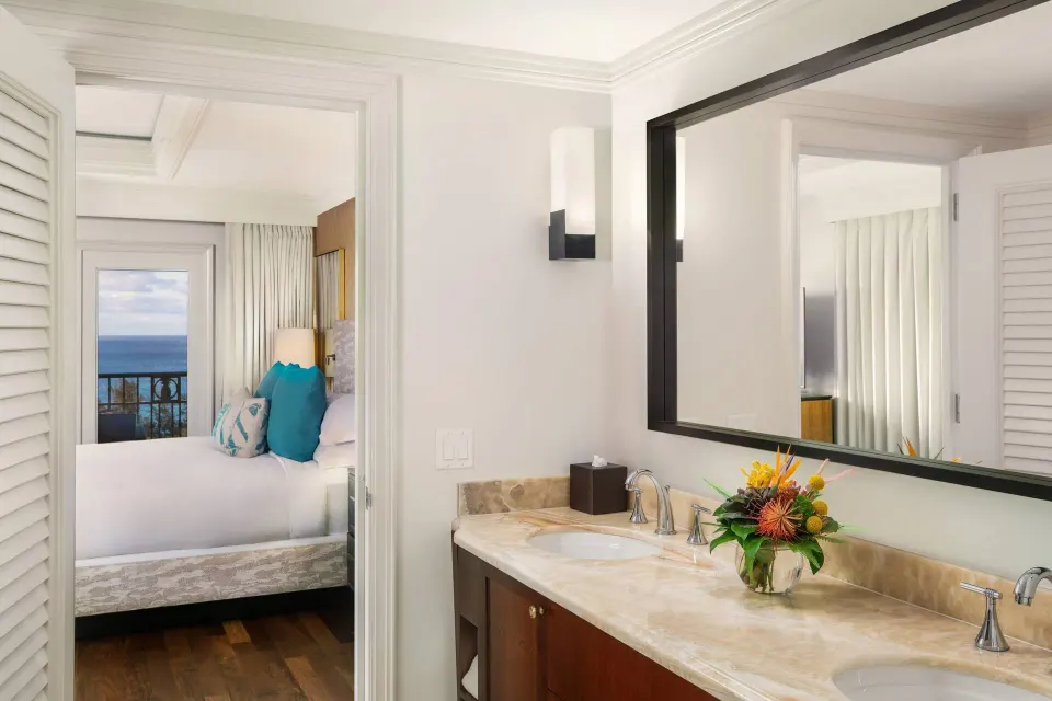 Presidential Suite bathroom and bedroom with ocean view at The Ritz-Carlton Maui, Kapalua.