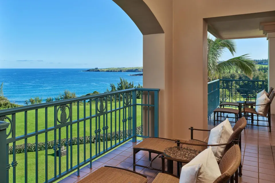 Presidential Suite lanai at The Ritz-Carlton Maui, Kapalua with ocean view and wicker seating.