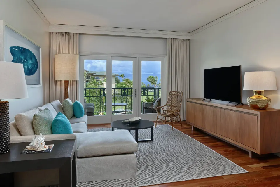 Residential Ocean Front Suite living room with balcony at The Ritz-Carlton Maui, Kapalua.