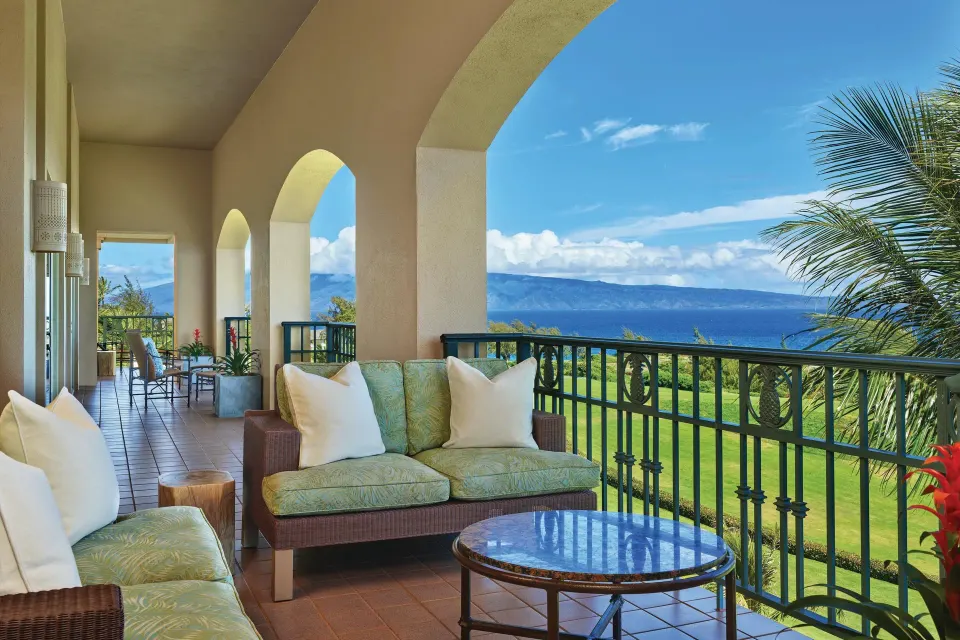 Royal Suite Oceanfront balcony at The Ritz-Carlton Maui, Kapalua with lounge seating and ocean views.