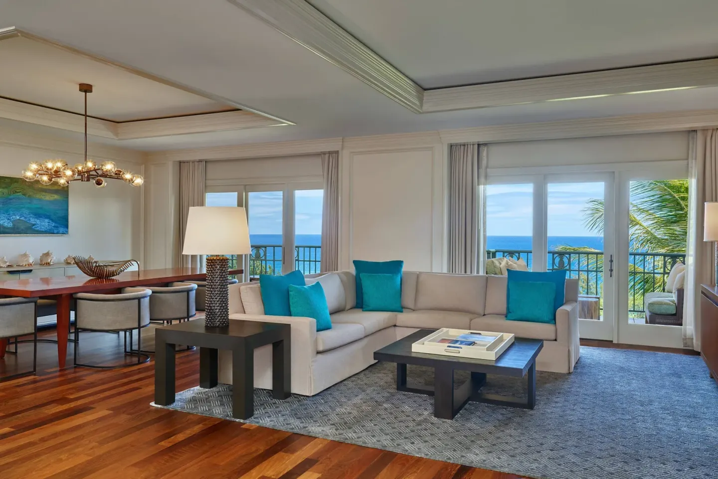 Royal Suite Oceanfront living and dining room at The Ritz-Carlton Maui, Kapalua with ocean-view doors.