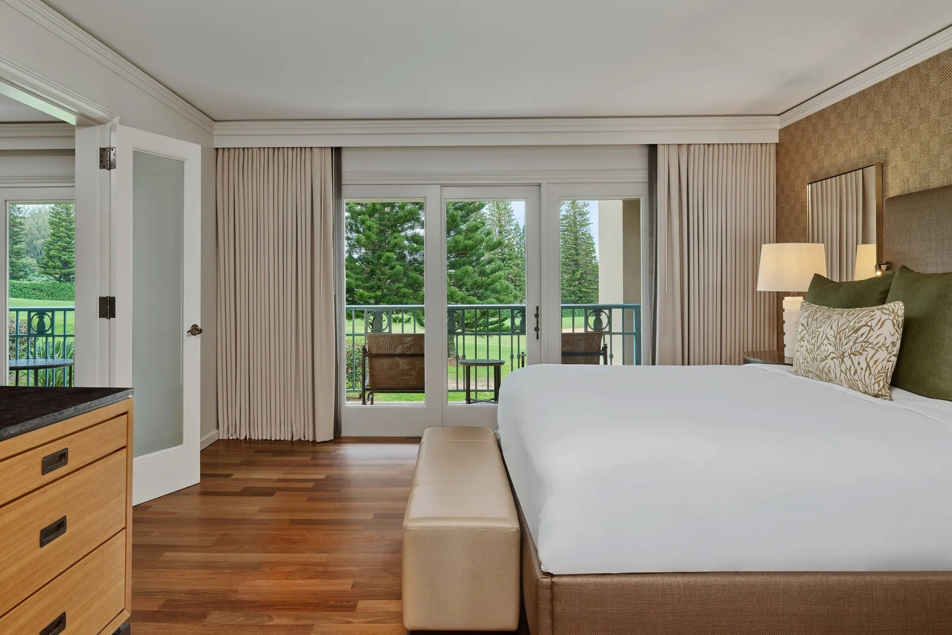 Terrace Room king bed with balcony doors at The Ritz-Carlton Maui, Kapalua.