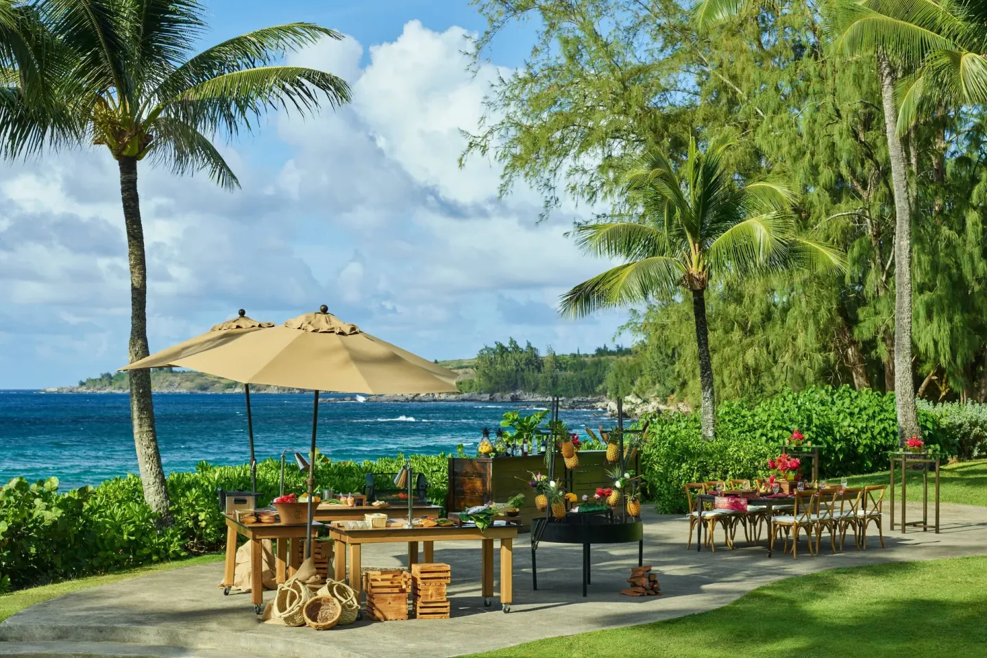 Oceanfront lawn event setup with palm trees at The Ritz-Carlton Maui, Kapalua.