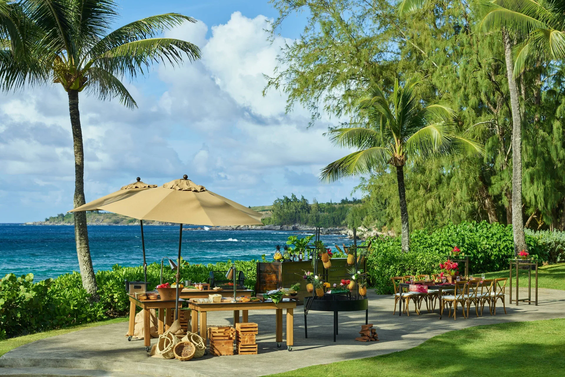 Oceanfront lawn event setup with palm trees at The Ritz-Carlton Maui, Kapalua.