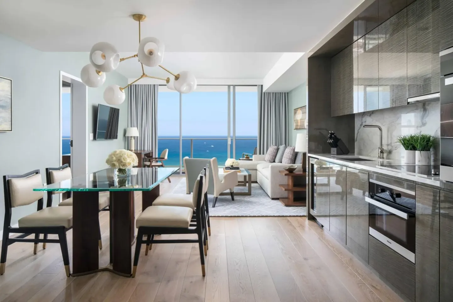 Ocean-view suite living area and kitchen at The Ritz-Carlton Residences, Waikiki Beach.