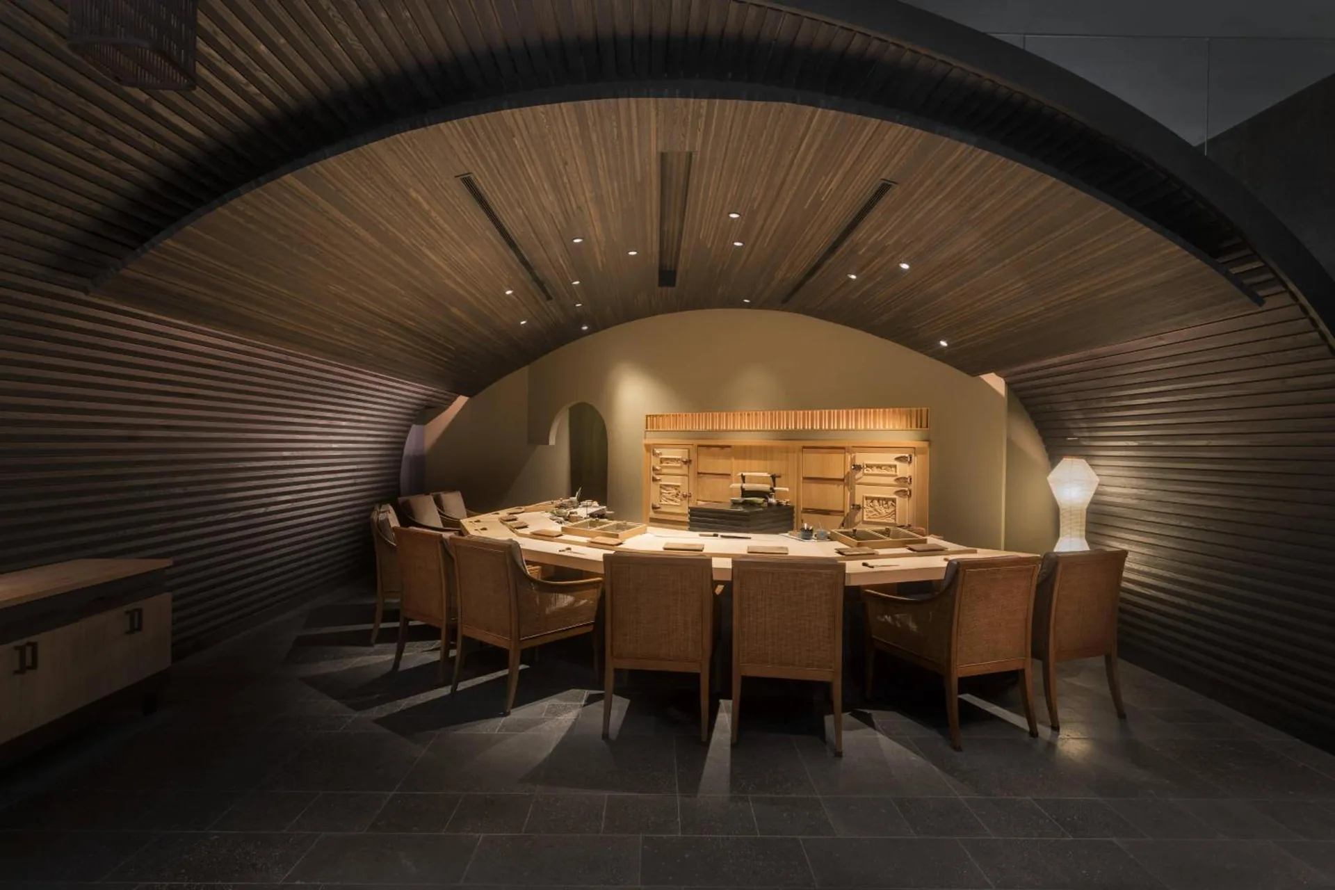 Sushi counter dining room at The Ritz-Carlton Residences, Waikiki Beach beneath an arched wood ceiling.