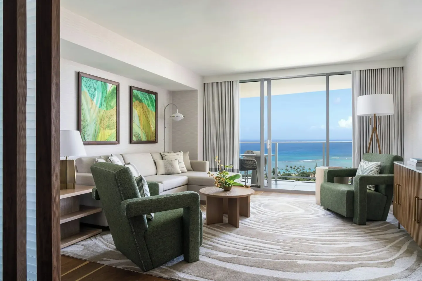 Grand Room Ocean View living area with balcony at The Ritz-Carlton Residences, Waikiki Beach.