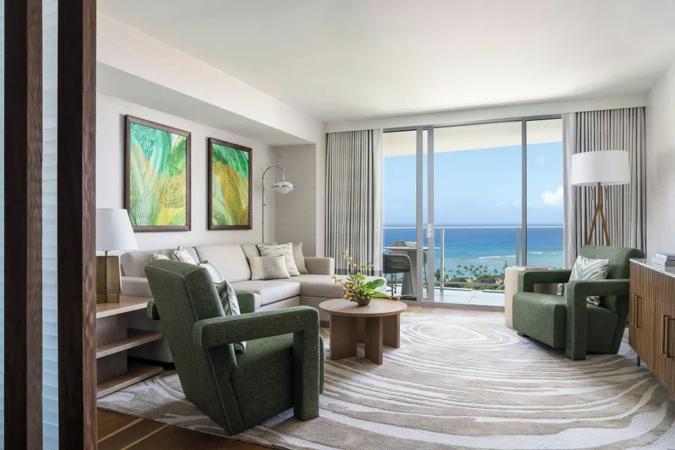 Grand Room Ocean View living area with balcony at The Ritz-Carlton Residences, Waikiki Beach.