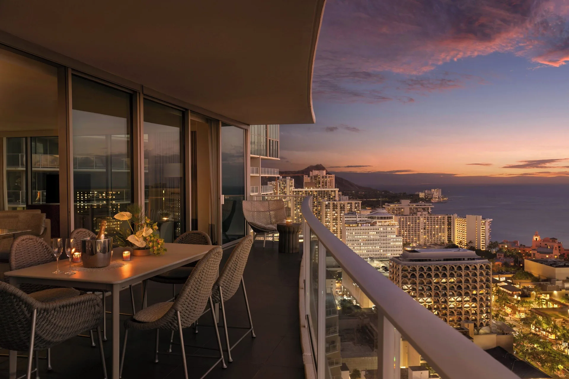 Sky Three-Bedroom Suite balcony dining at sunset at The Ritz-Carlton Residences, Waikiki Beach.