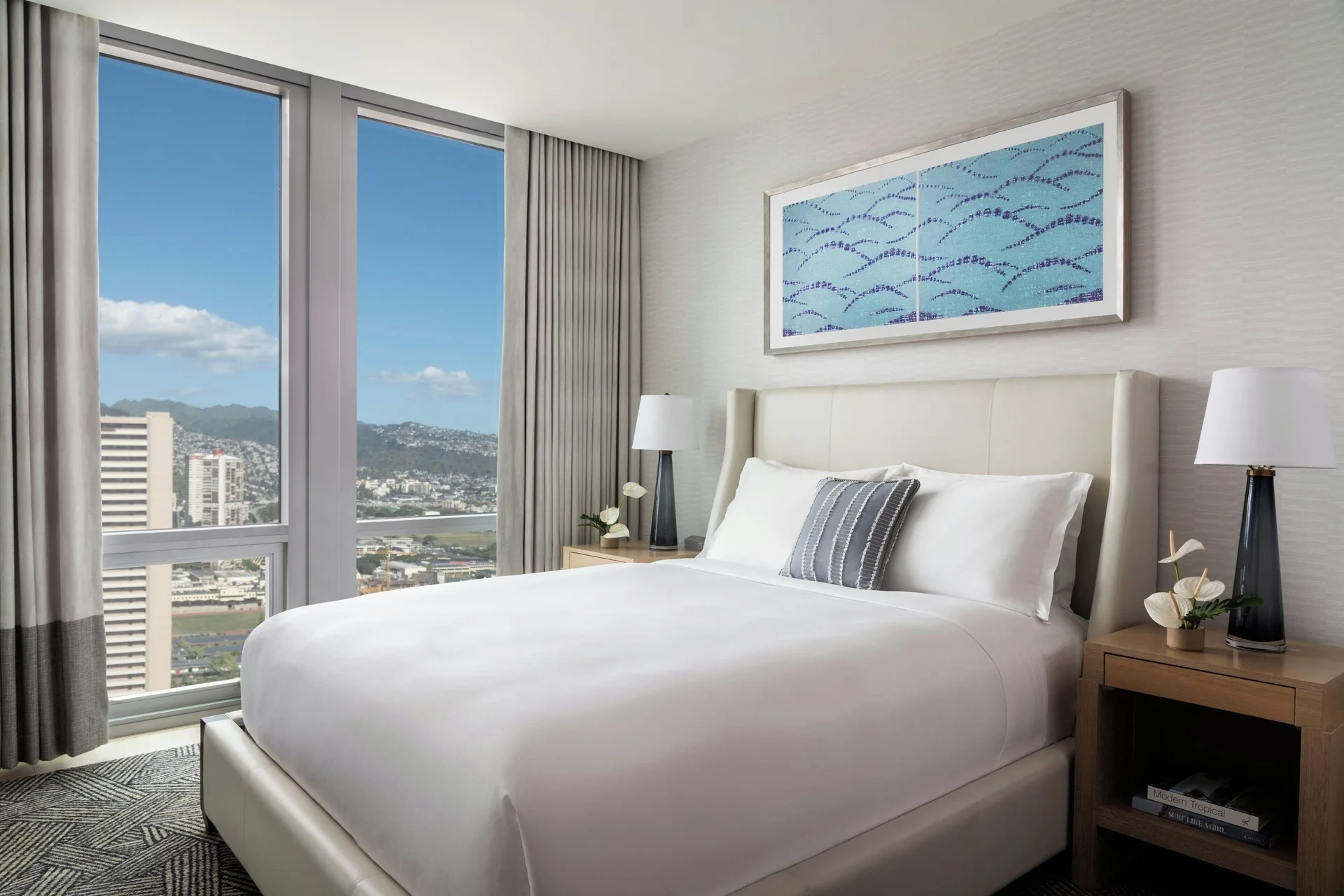 Sky Three-Bedroom Suite bedroom with mountain and city views at The Ritz-Carlton Residences, Waikiki Beach.