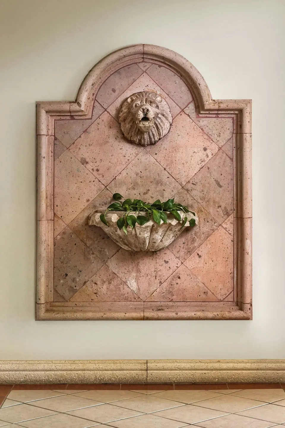Decorative stone wall fountain with planter at The Ritz-Carlton, St. Thomas.
