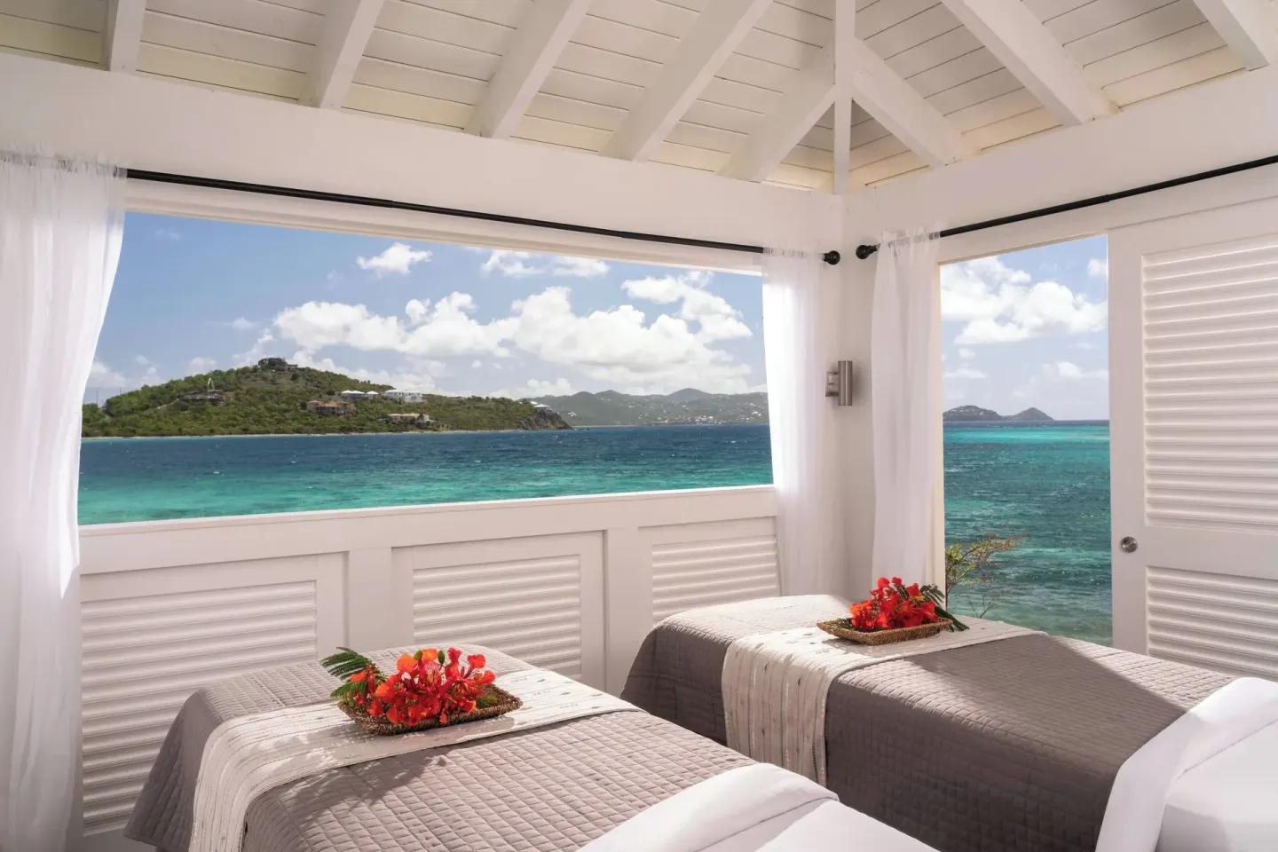 Oceanfront spa room with two treatment tables at The Ritz-Carlton, St. Thomas.