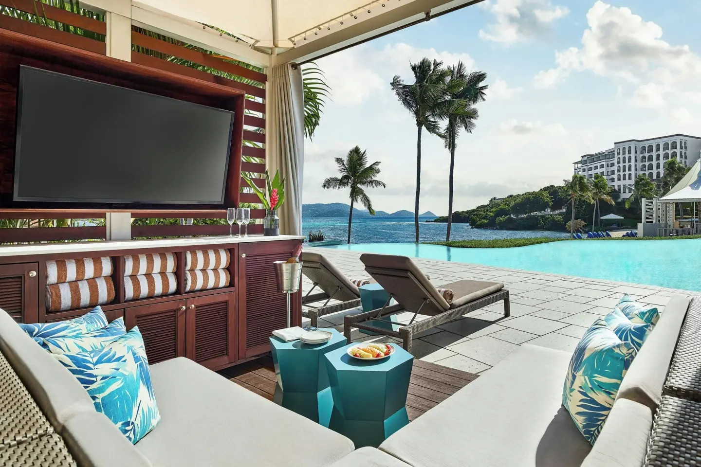 Poolside cabana lounge with television and ocean view at The Ritz-Carlton, St. Thomas.