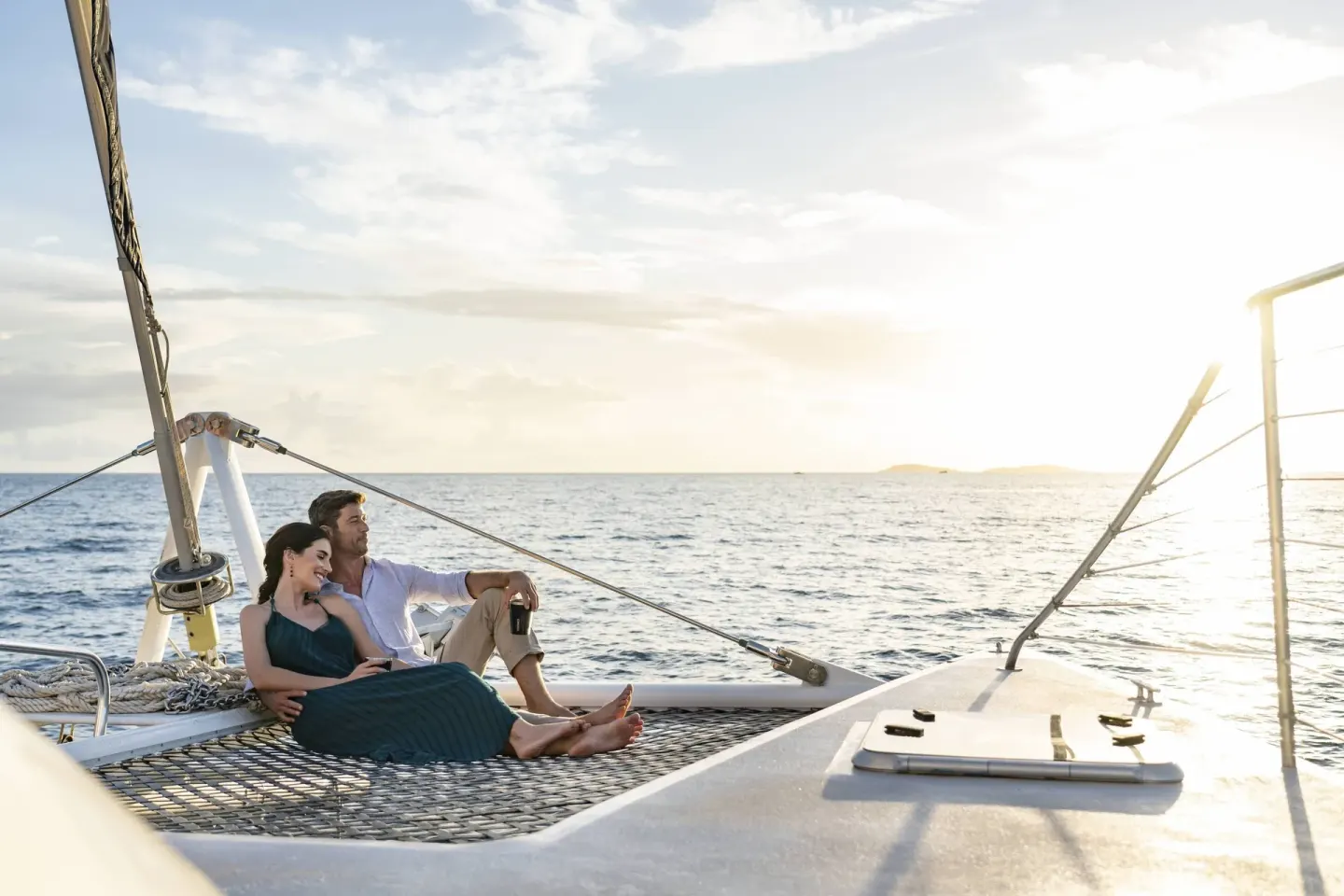 Couple relaxing on a sailboat near The Ritz-Carlton, St. Thomas.
