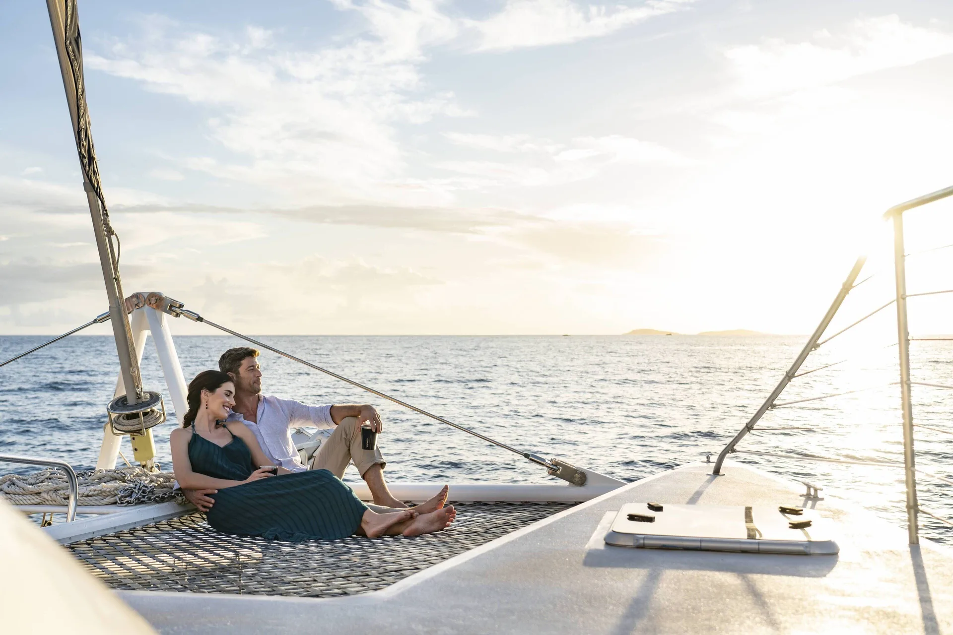 Couple relaxing on a sailboat near The Ritz-Carlton, St. Thomas.