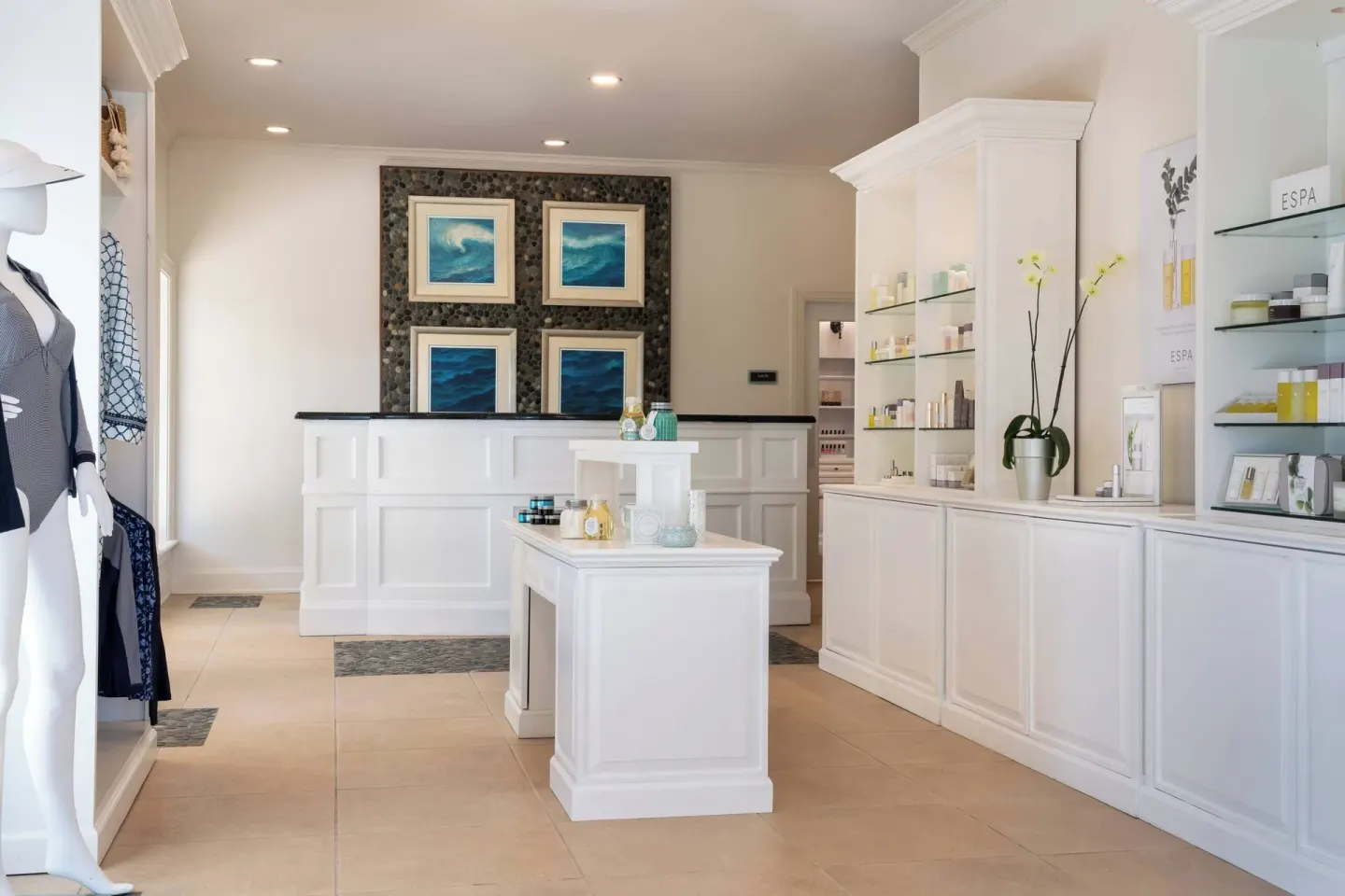 Spa boutique with reception desk and product displays at The Ritz-Carlton, St. Thomas.