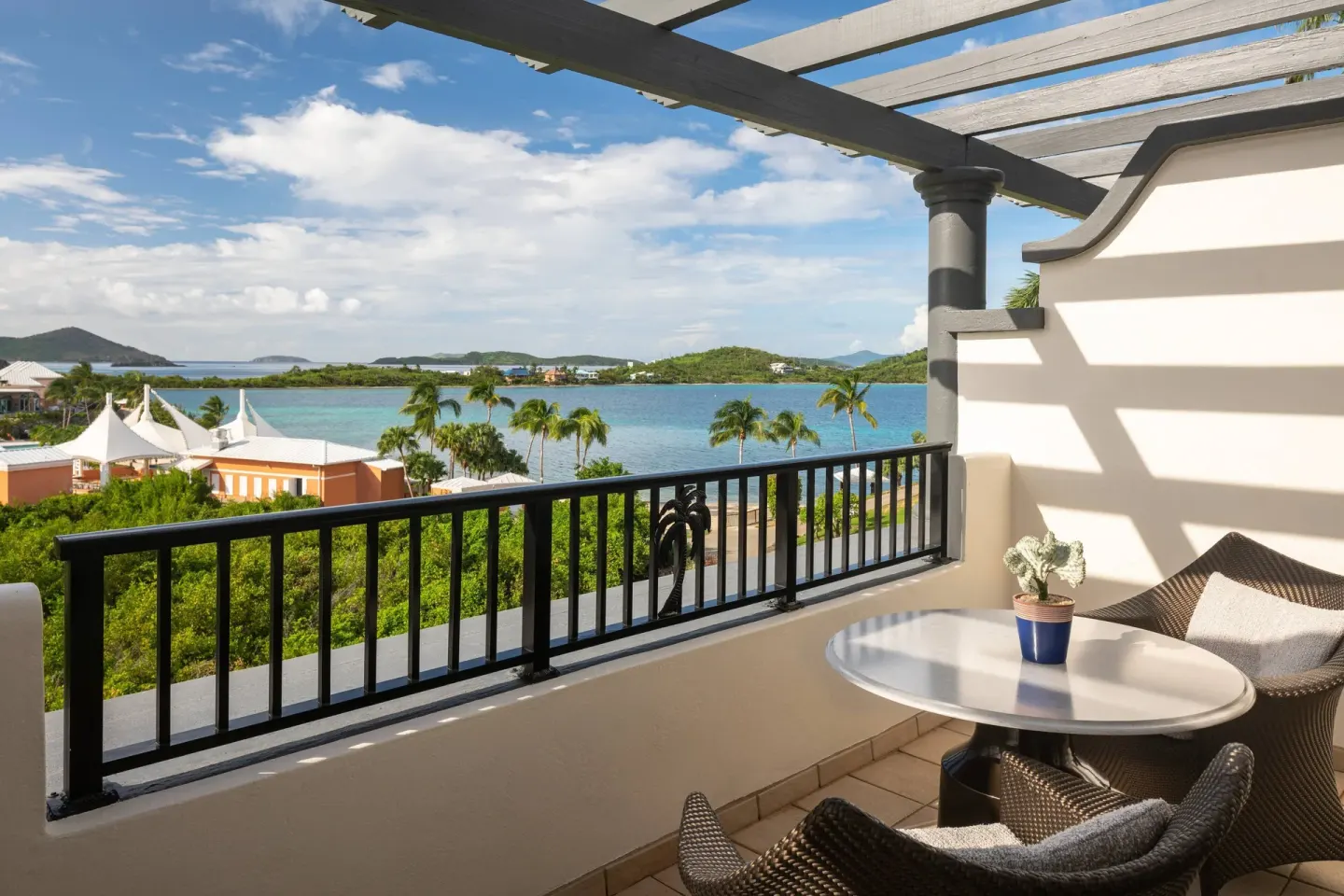 Club Ocean View Room balcony with seating and water views at The Ritz-Carlton, St. Thomas.