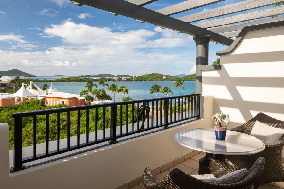 Club Ocean View Room balcony with seating and water views at The Ritz-Carlton, St. Thomas.