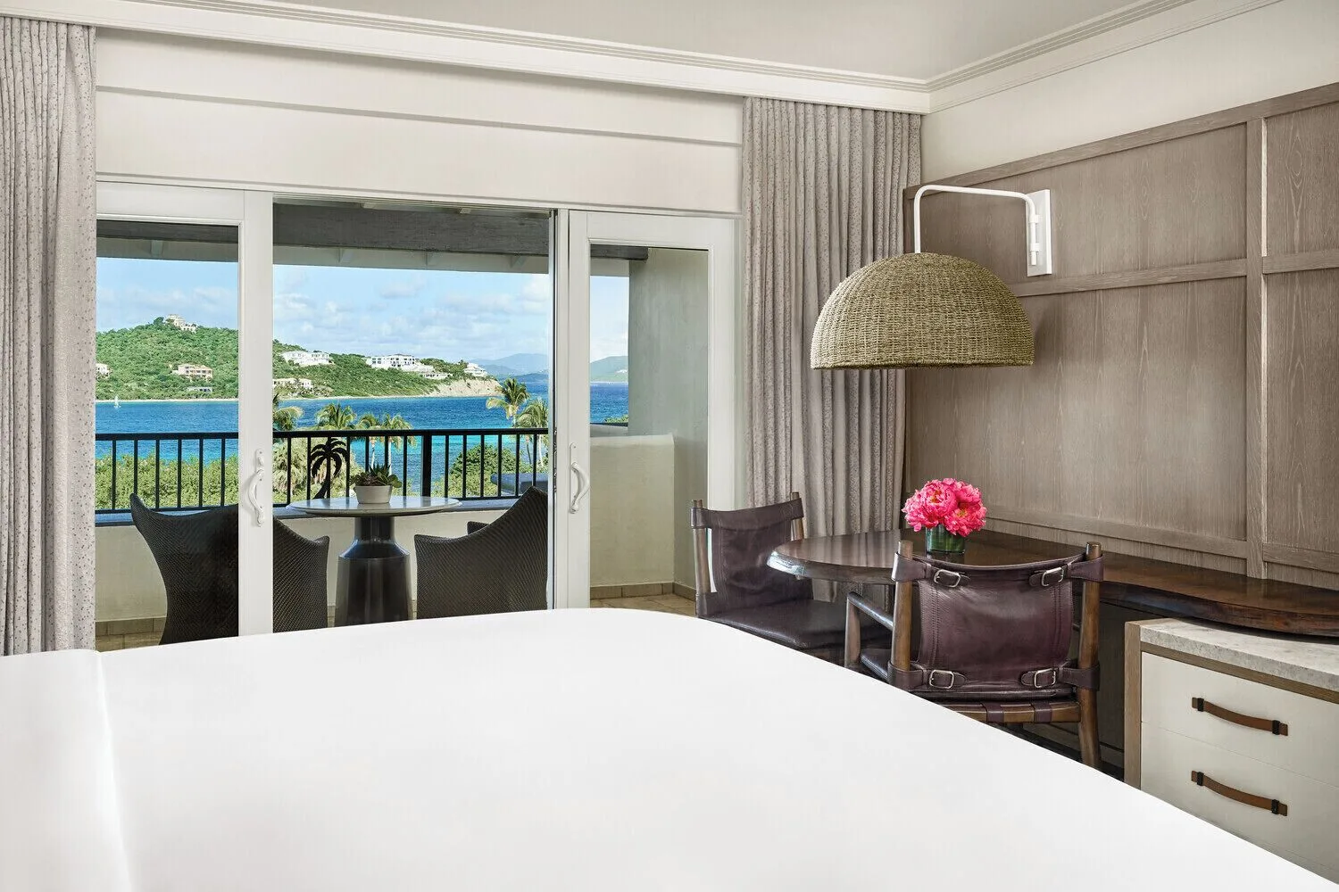 Club Ocean View Room bed, desk, and balcony view at The Ritz-Carlton, St. Thomas.